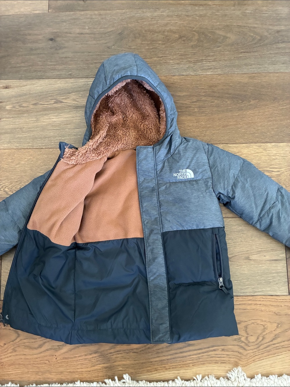 The North Face Kids Two-Tone Gray and Black Hooded Jacket with Brown Lining